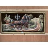 A LARGE FRAMED WALL HANGING OF A HORSE AND CART SCENE