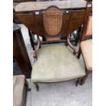 AN INLAID MAHOGANY NURSING CHAIR WITH RATTAN BACK