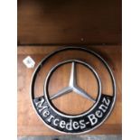 A CAST MERCEDES BENZ SIGN