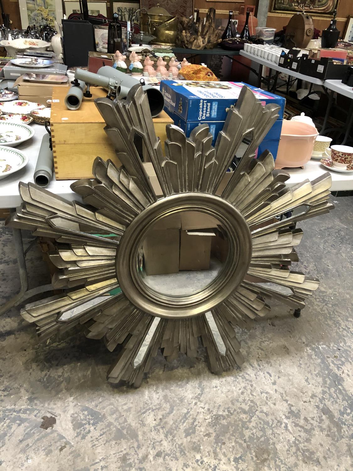 AN AS NEW AND BOXED STARBURST SILVER DESIGN MIRROR