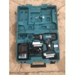A MAKITA CORDLESS DRILL WITH TWO BATTERIES AND CHARGER IN A CASE