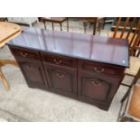 A MAHOGANY SIDEBOARD WITH THREE DOORS AND THREE DRAWERS