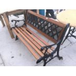 A WOODEN GARDEN BENCH WITH CAST SLATTED BACK AND ENDS