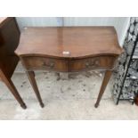 A WALL FIXED MAHOGANY HALL TABLE ON TWO TAPERED SUPPORTS WITH TWO DRAWERS