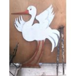 A LARGE WOODEN PAINTED CUT OUT OF A STORK