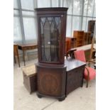 A MAHOGANY CORNER CABINET WITH LOWER DOOR AND UPPER GLAZED PANEL DOOR