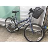A LADIES DIAMOND BACK BIKE WITH SHOPPING BASKET AND AN EIGHTEEN SPEED SHIMANO GEAR SYSTEM