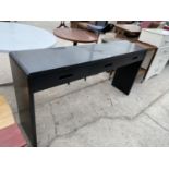 A MODERN BLACK HALL TABLE WITH THREE DRAWERS
