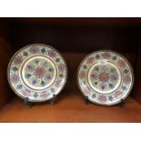 A PAIR OF DECORATIVE CERAMIC COALPORT PLATES