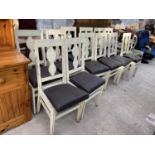 TWELVE WHITE FRAMED CHAIRS WITH BLACK SEATS