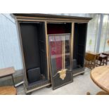 A BLACK AND GILDED CABINET WITH GLAZED CENTRE DOOR (REQUIRES OUTER DOORS