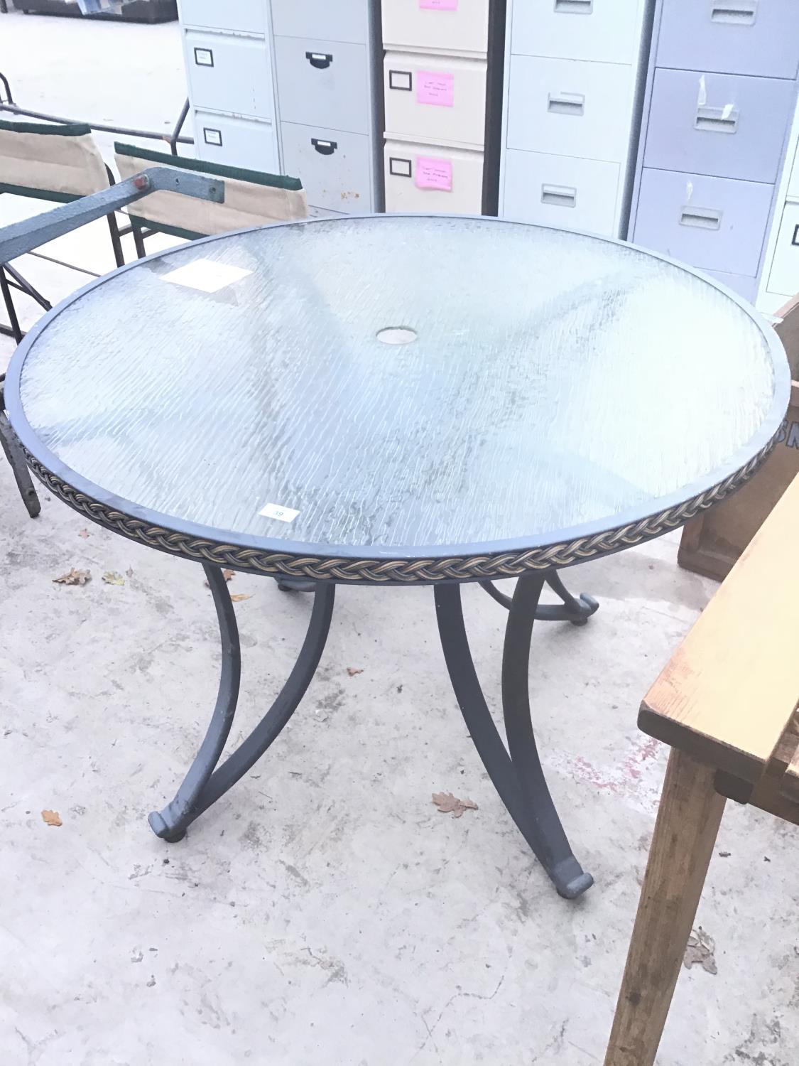 A CIRCULAR TOPPED TABLE