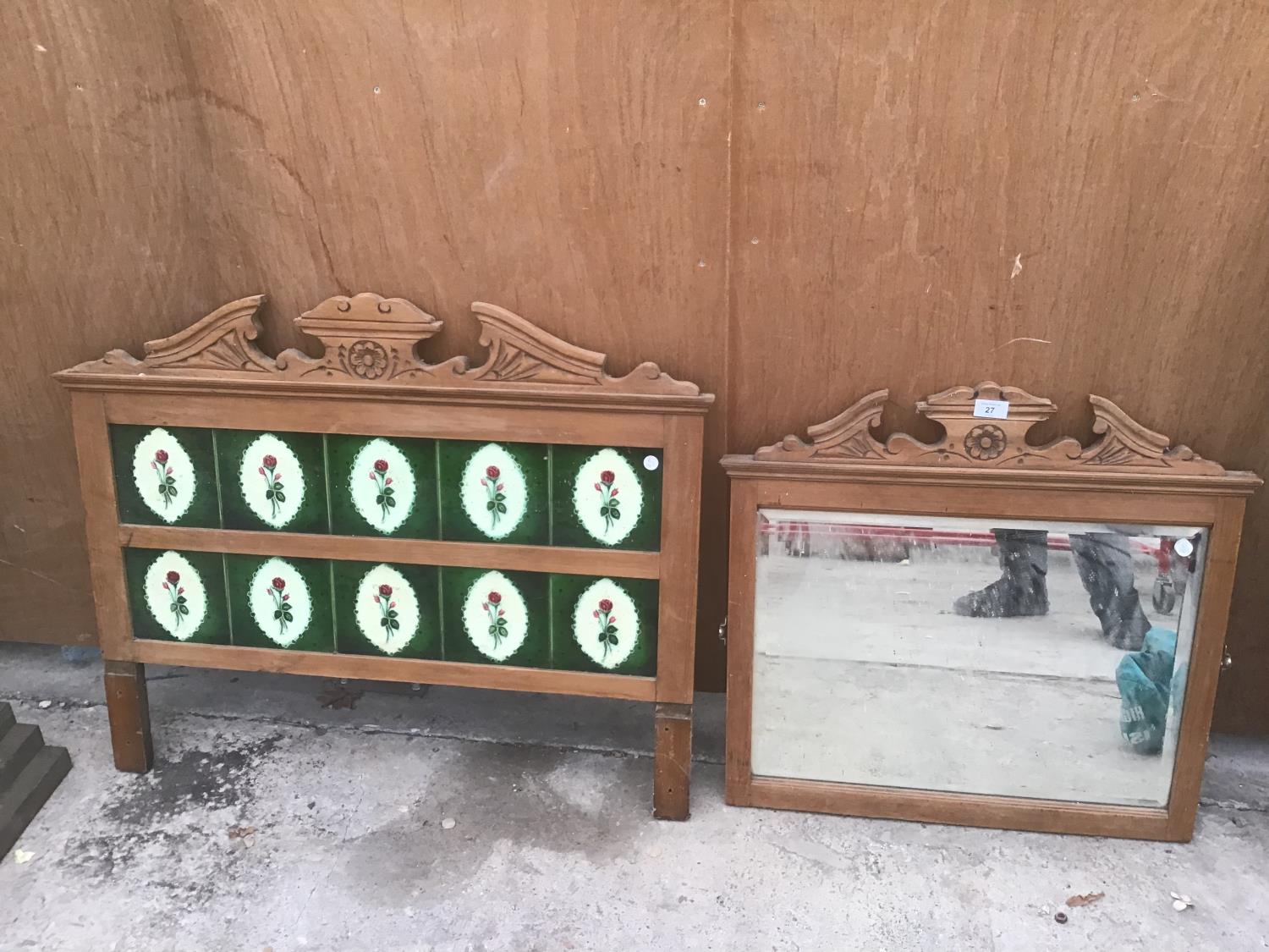 A ORNATE PINE MIRROR AND A TILED SPLASH BACK