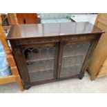 A PRIORY STYLE OAK CABINET WITH TWO LEAD GLAZED DOORS