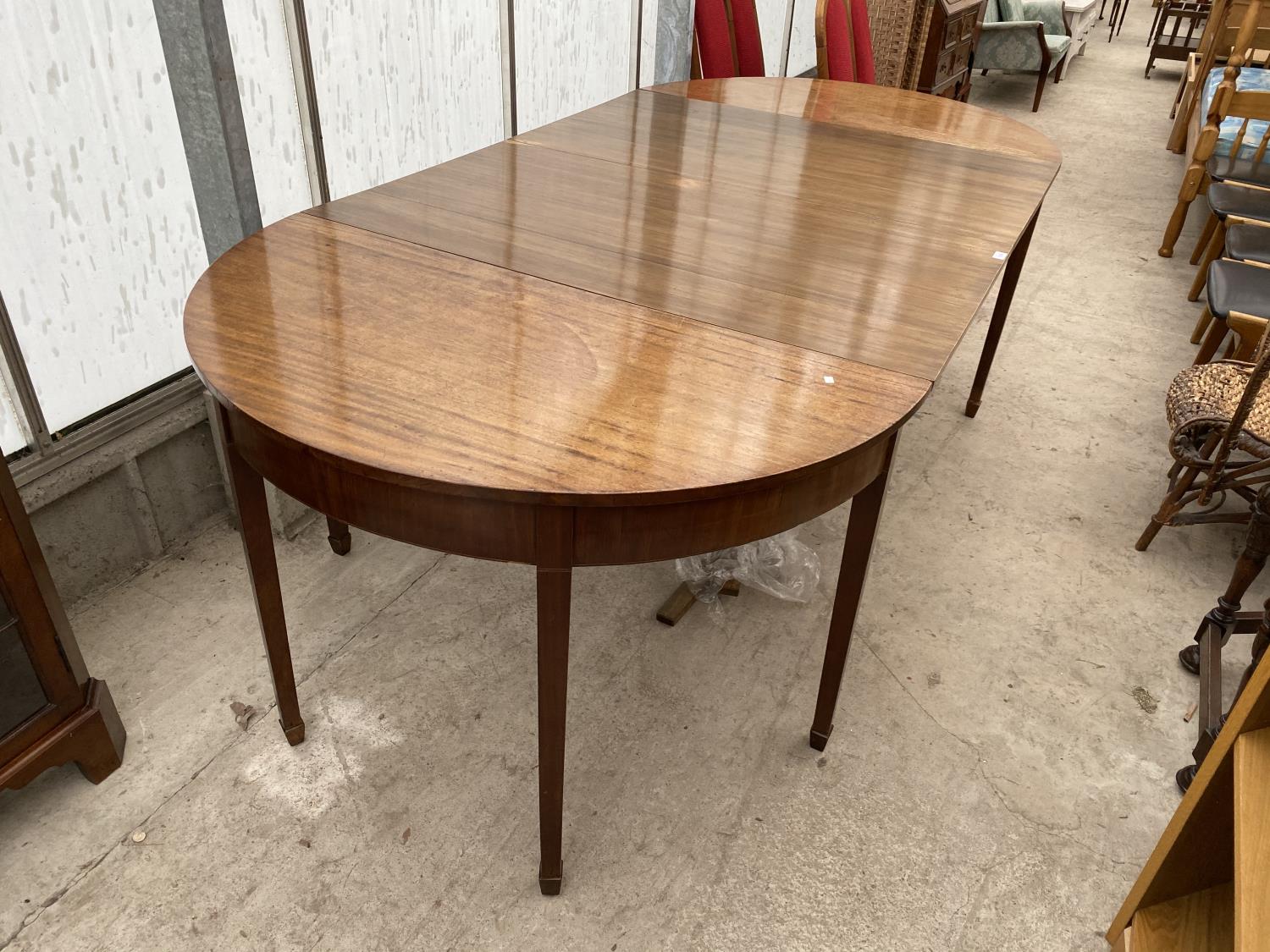 A GEORGIAN MAHOGANY D END DINING TABLE WITH TWO LEAVES AND FIXING PLATES