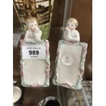 A PAIR OF CERAMIC CONTINENTAL CHERUB PLAQUES