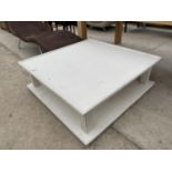 A MODERN WHITE SQUARE COFFEE TABLE WITH LOWER SHELF