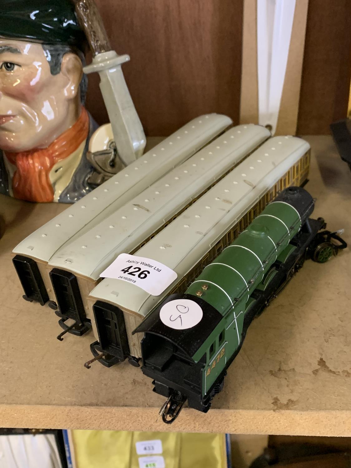 A HORNBY FLYING SCOTSMAN MODEL AND THREE CARRIAGES