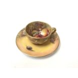 A ROYAL WORCESTER HAND PAINTED 'FRUIT STUDY' MINIATURE CUP AND SAUCER, BOTH SIGNED J.SKERRETT