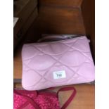 A LIMITED RUN PINK LADIES HANDBAG