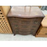 A BOW FRONT MAHOGANY CHEST OF FOUR DRAWERS WITH DRESSING SLIDE