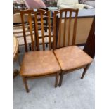 A PAIR OF TEAK DINING CHAIRS