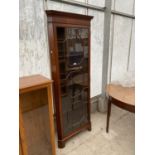 A MAHOGANY CORNER CABINET WITH SINGLE GLAZED PANEL DOOR