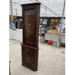 AN OAK CORNER CABINET WITH LOWER DOOR AND DRAWER AND UPPER LEAD GLAZED DOOIR