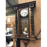 A MAHOGANY VIENNA WALL CLOCK WITH PENDULUM