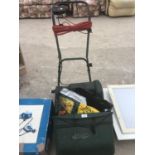 AN ELECTRIC MOWER WITH GRASS BOX IN WORKING ORDER