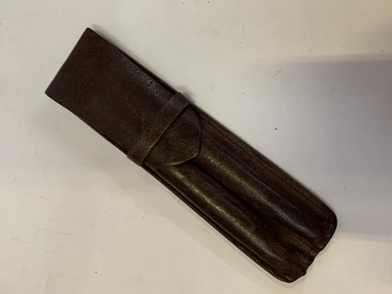 A VINTAGE LEATHER PEN HOLDER