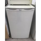 A WHIRLPOOL UNDER COUNTER FRIDGE IN WORKING ORDER (DOOR SHELF MISSING)