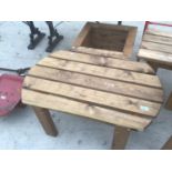 A WOODEN GARDEN LOW TABLE AND A SQUARE PLANTER