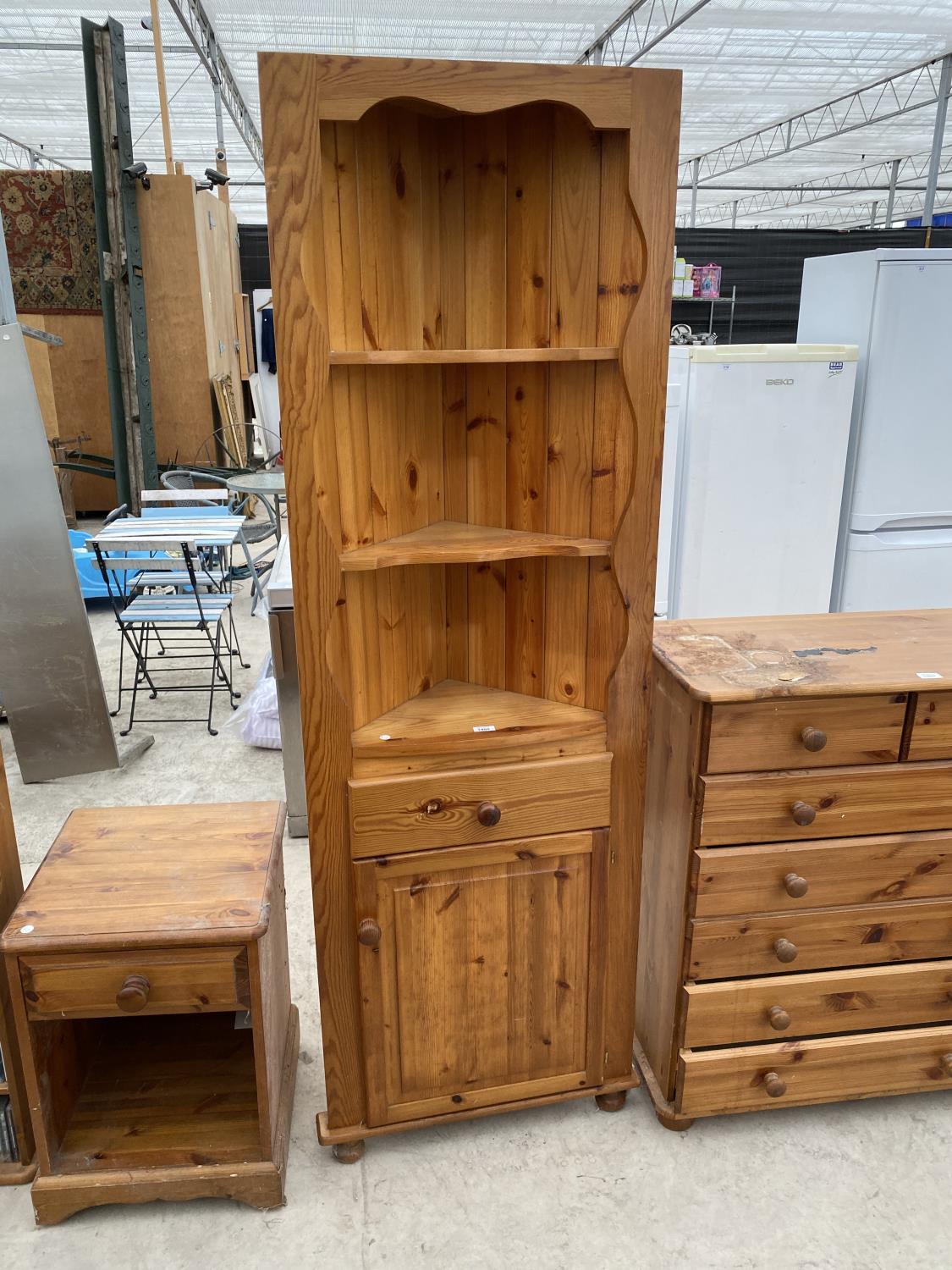 A PINE CORNER CABINET WITH LOWER DOOS