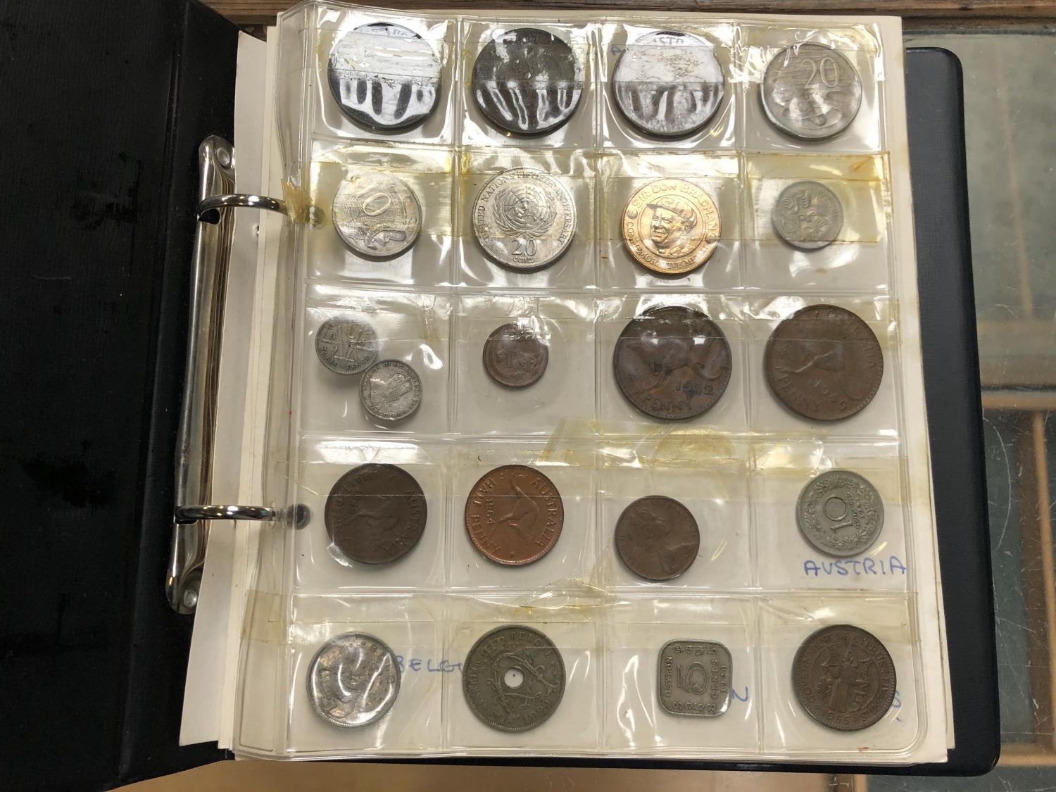 AN ALBUM OF ASSORTED WORLD COINAGES, SOME SILVER ETC