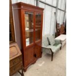 A YEW WOOD CABINET WITH TWO LOWER DOORS AND TWO UPPER GLAZED DOORS
