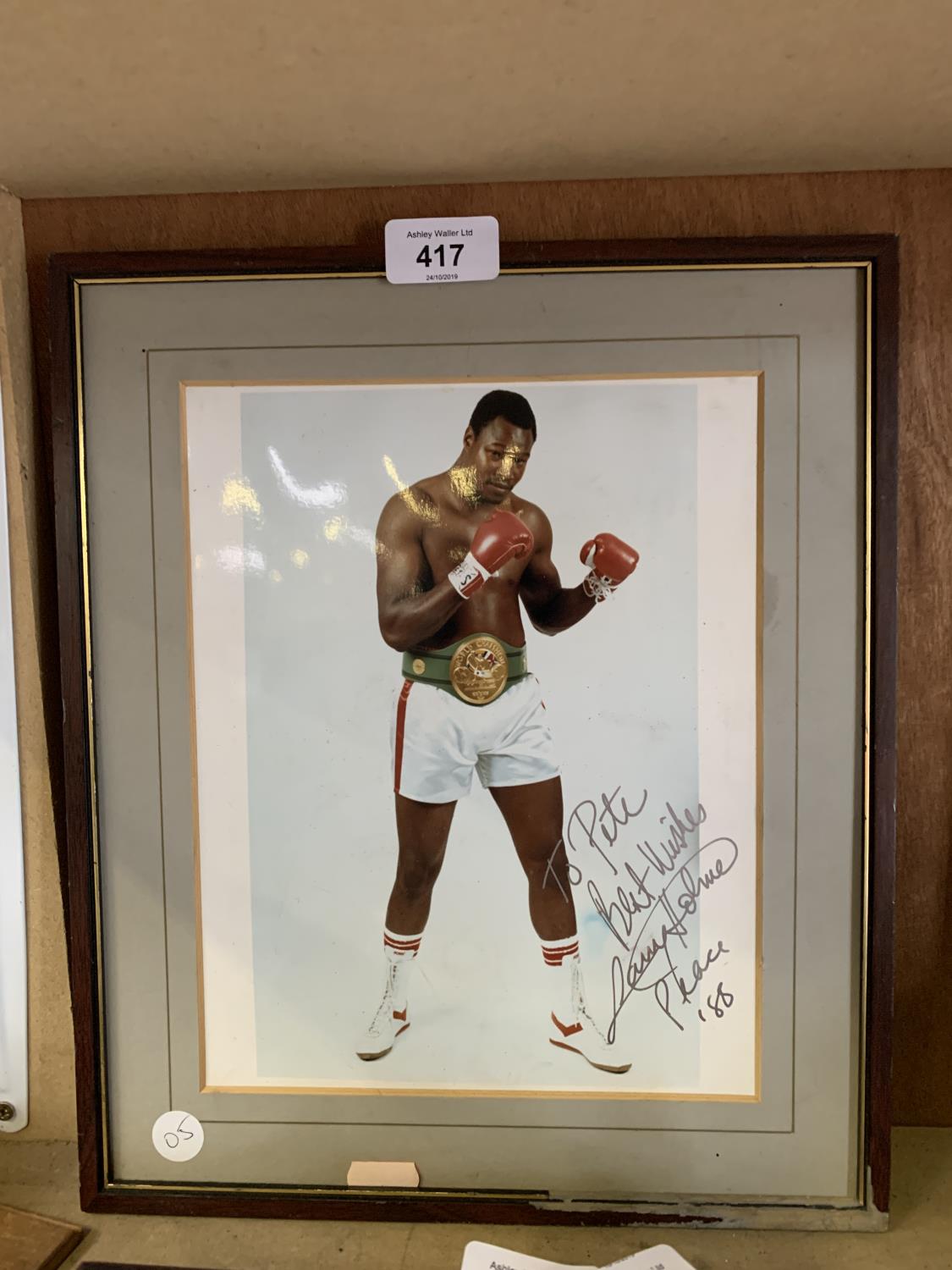 A SIGNED PHOTO OF LARRY HOLMES