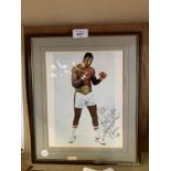 A SIGNED PHOTO OF LARRY HOLMES