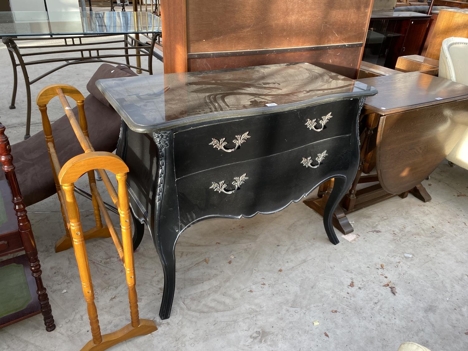 AN ORNATE BLACK CHEST OF DRAWERS WITH TWO LONG DRAWERS
