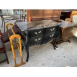 AN ORNATE BLACK CHEST OF DRAWERS WITH TWO LONG DRAWERS