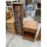 A WICKER CHEST OF THREE DRAWERS, A PINE CD RACK AND A PINE BEDSIDE CABINET