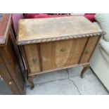 A MAHOGANY CHEST WITH TWO SMALL DOORS AND FALL FRONT