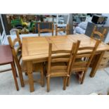 A PINE DINING TABLE AND SIX DINING CHAIRS