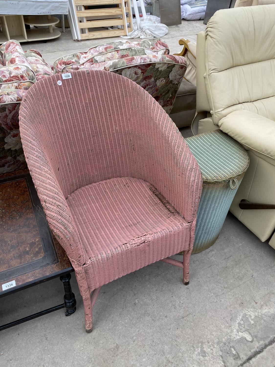 A LLOYD LOOM CHAIR AND LINEN BASKET (ONE WITH LABEL)