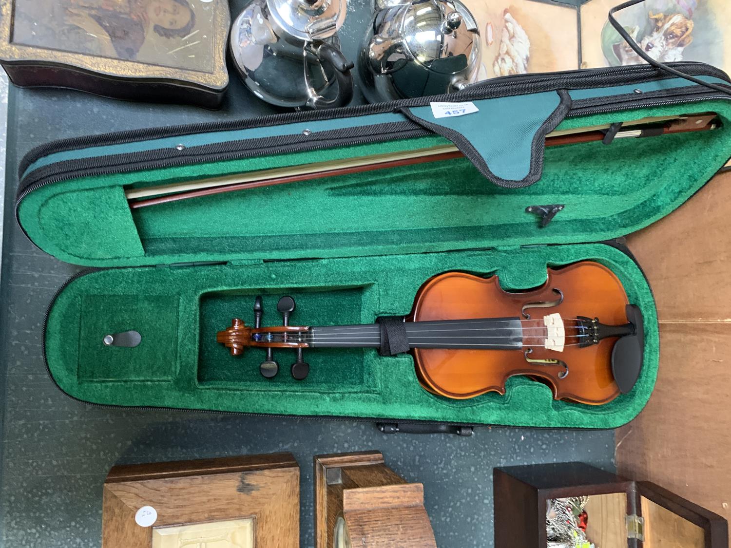 A CHILD'S VIOLIN WITH CASE AND BOW