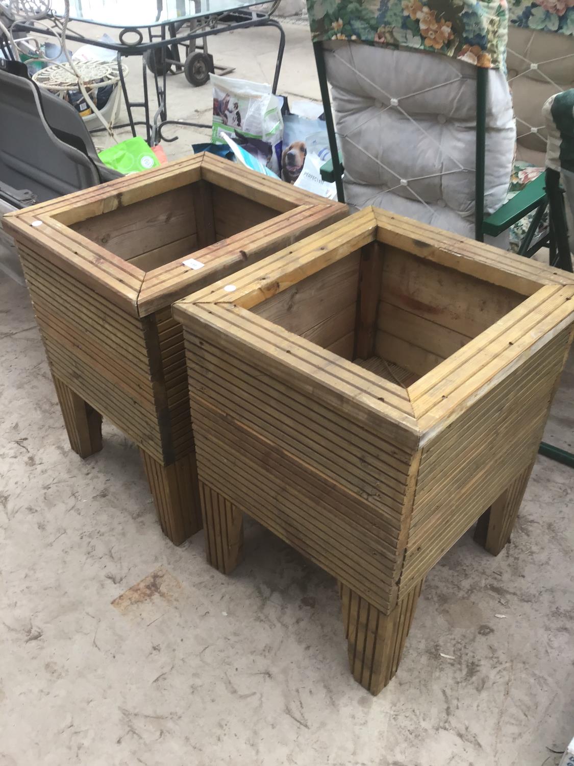 A PAIR OF WOODEN PLANTERS 47CM X 50CM APPROX