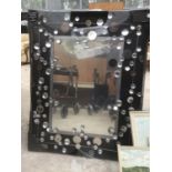 AN ORNATE MIRROR WITH CRYSTAL DECORATION