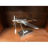 A CHROME EFFECT METAL MODEL SPITFIRE ON BASE