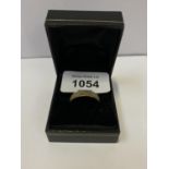 A BOXED GOLD ON SILVER RING
