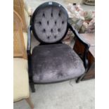 A BLACK FRAMED NURSING CHAIR WITH GREY UPHOLSTERED SEAT AND BUTTON BACK. THIS CHAIR COST £1300 AT